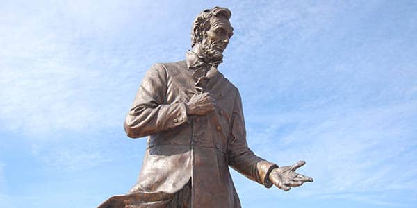 A statue of Abe Lincoln gesturing persuasively.