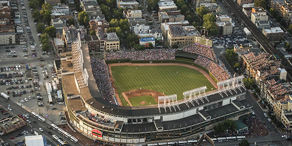 An aerial shot of Wrigley Field, an old-school Major League baseball stadium.