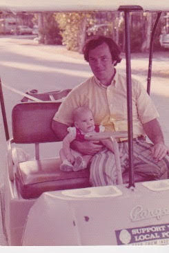 Woodsmoke Camping Resort - old photograph Dad and Daughter on golf cart