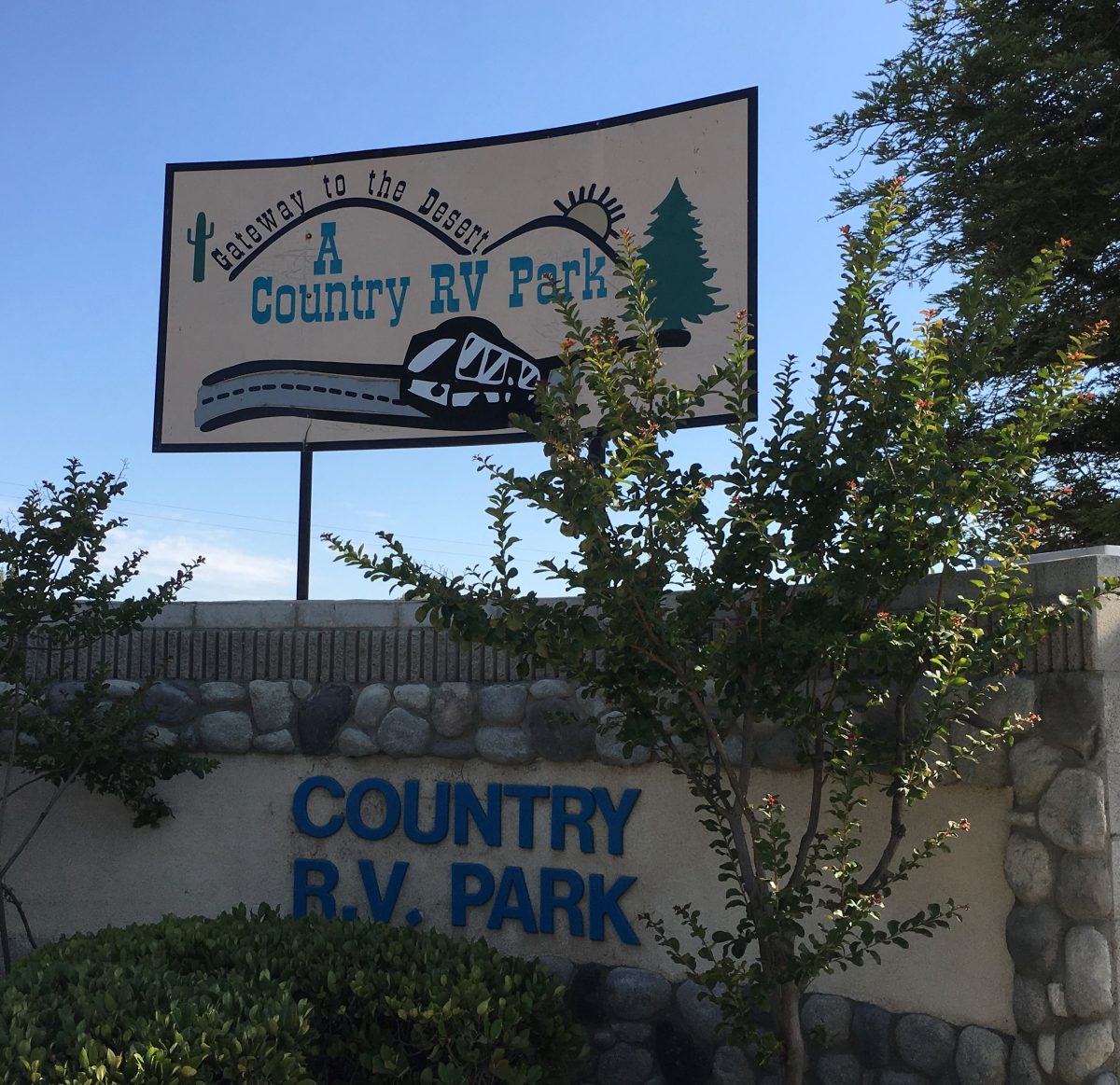 A Country RV Park - entrance sign