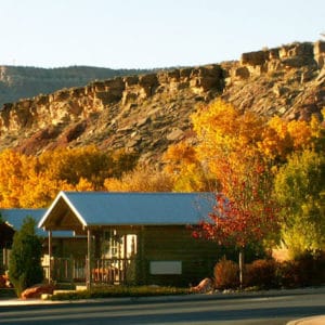 Beautiful cabin in fall tree setting for Zion RV Park