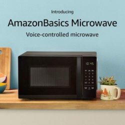 Amazon Basics Black Microwave with Amazon Alexa features sitting on countertop.
