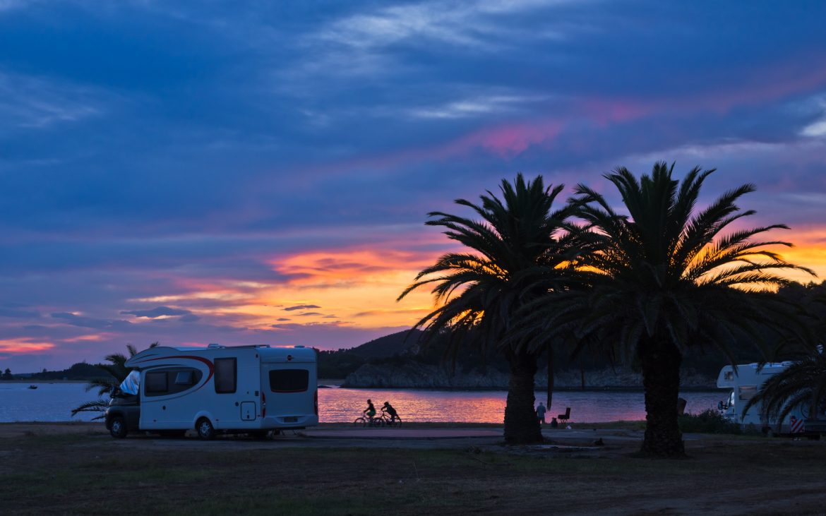 Camper at Sunset with kids playing