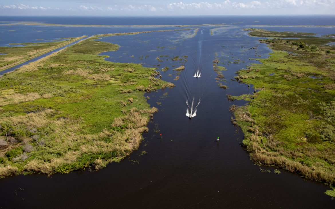 Aerial view of Lake Okeechobee with boats cruising on water