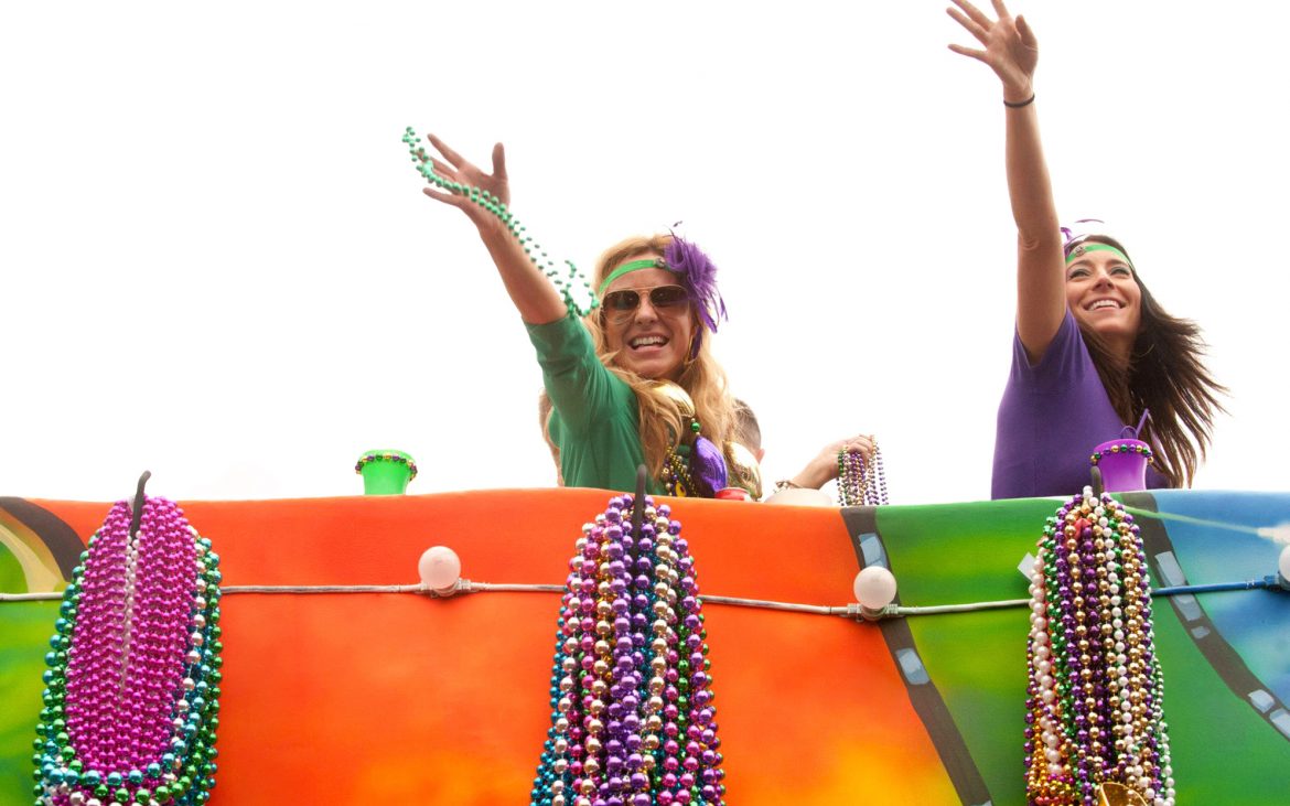 Attractive young women on madri gras parade float