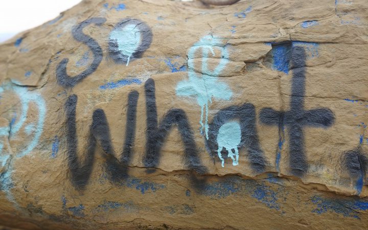 So What graffiti on rock