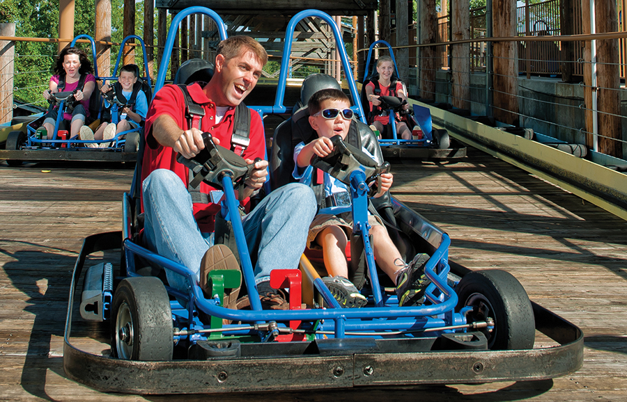 A go-karts race along a wooden track in Branson, Missouri.
