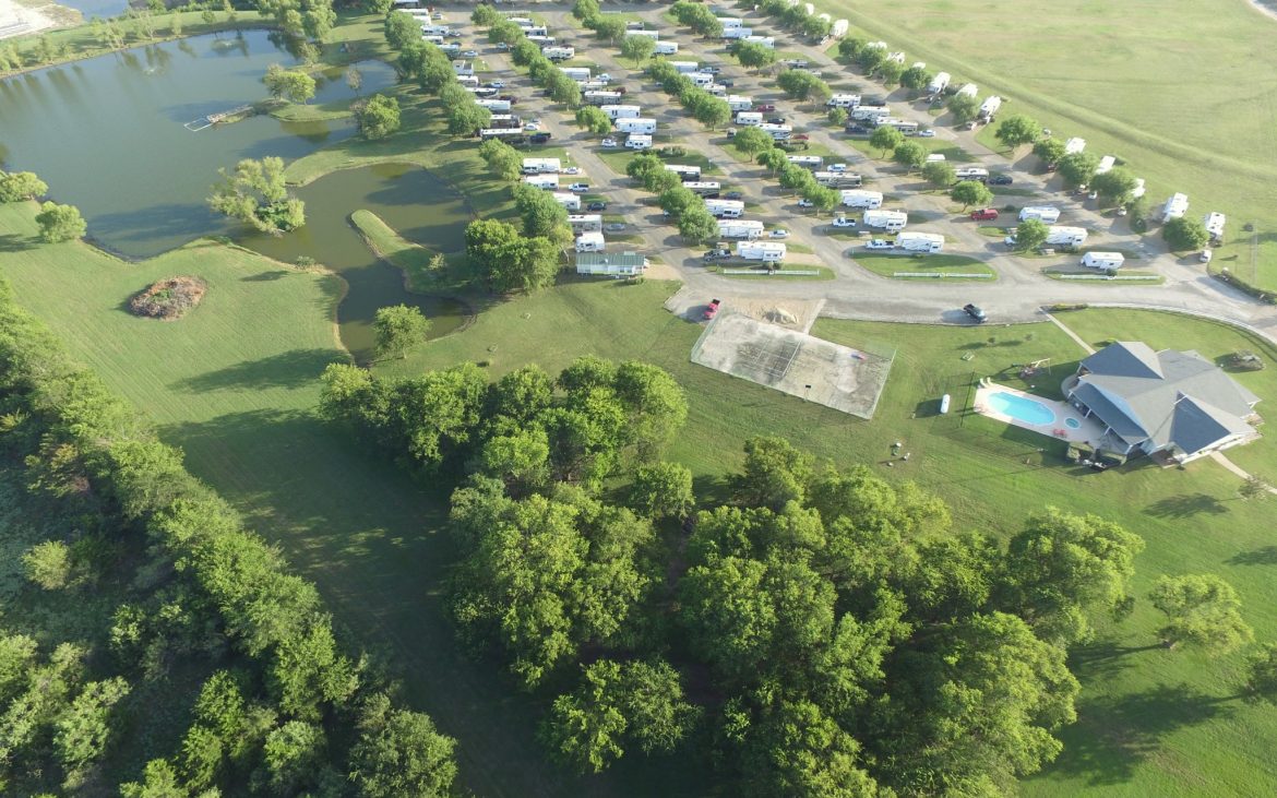 Aerial view of many RVs and trailers parked at spots