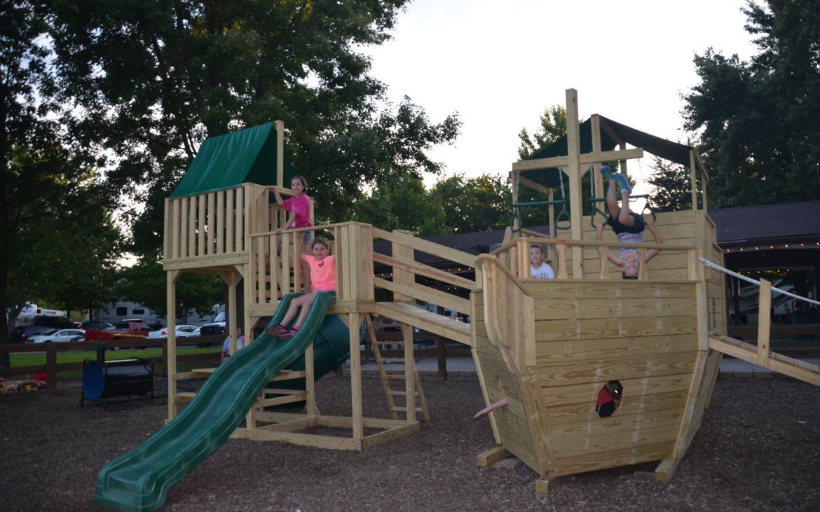 Wooden children's playground shaped like a pirate ship