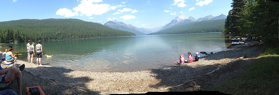 Beachside on a clear lake in Glacier National Park.