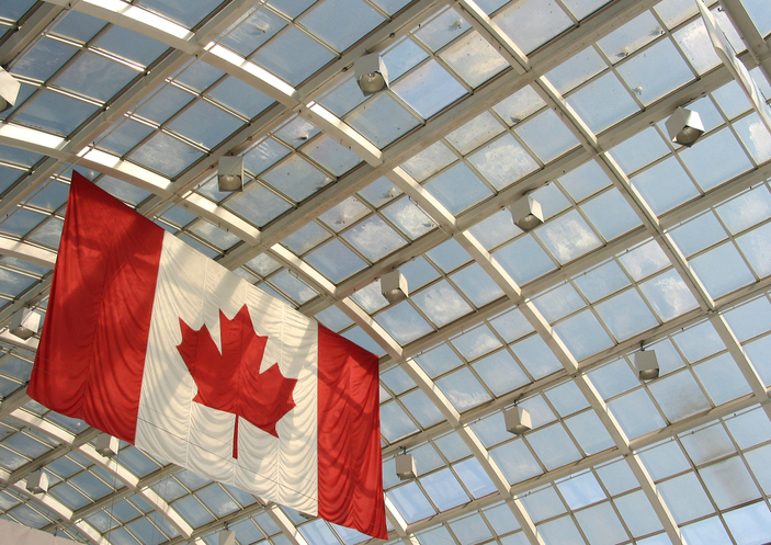 Red and white Canadian flag hanging from ceiling