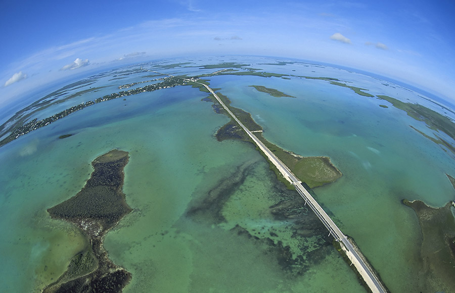 A spectacular aerial shot of the clear waters on either side of Florida's Overseas Highway.