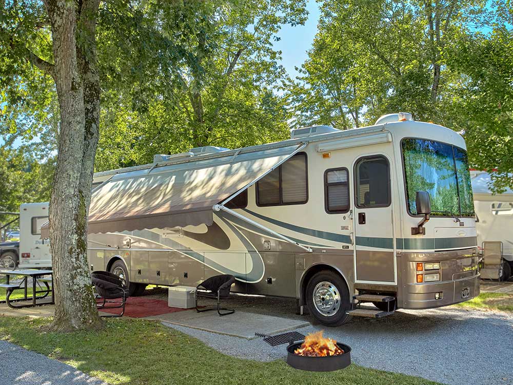 Large taupe RV at well groomed RV spot