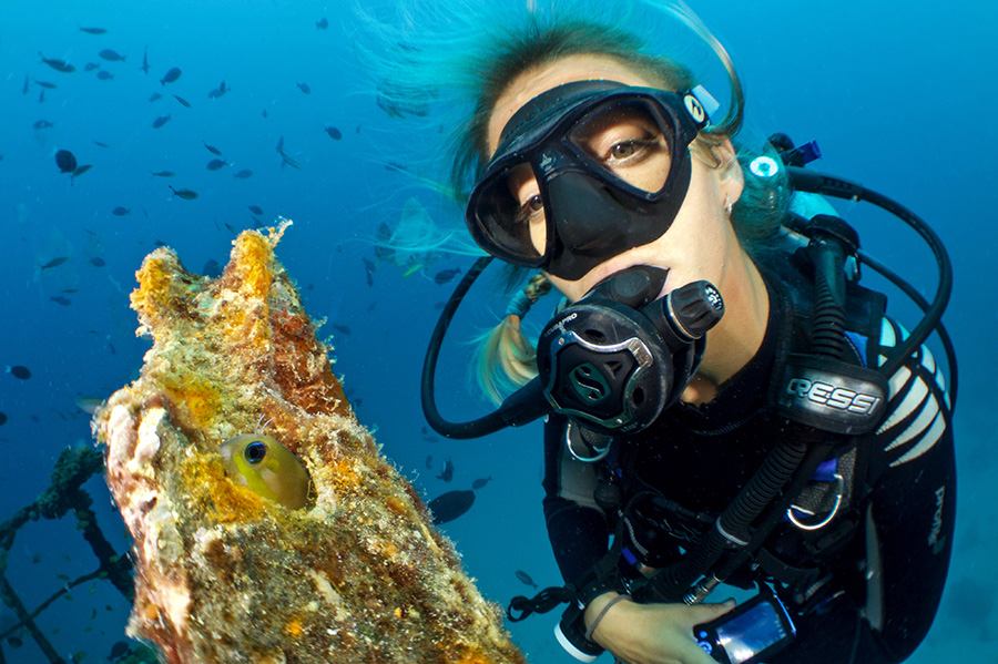 A diver explores a sunken ship in the Keys.