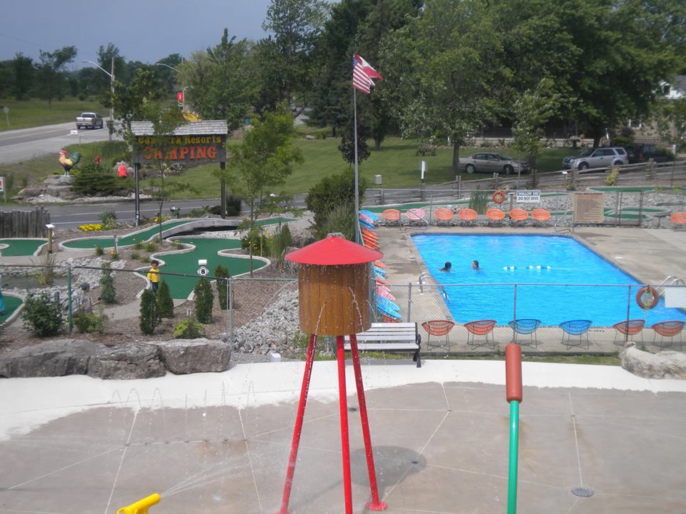 Aerial view of mini golf course alongside community pool.