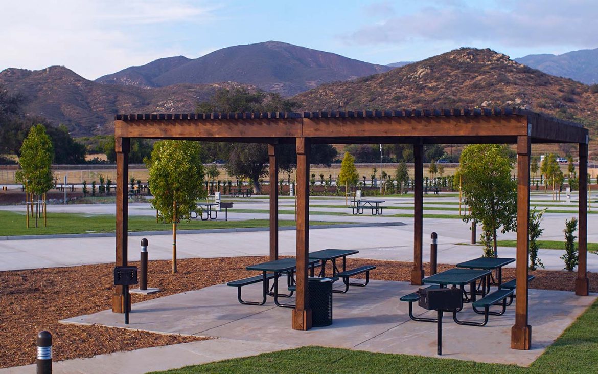 Park benches under wood patio cover at RV park