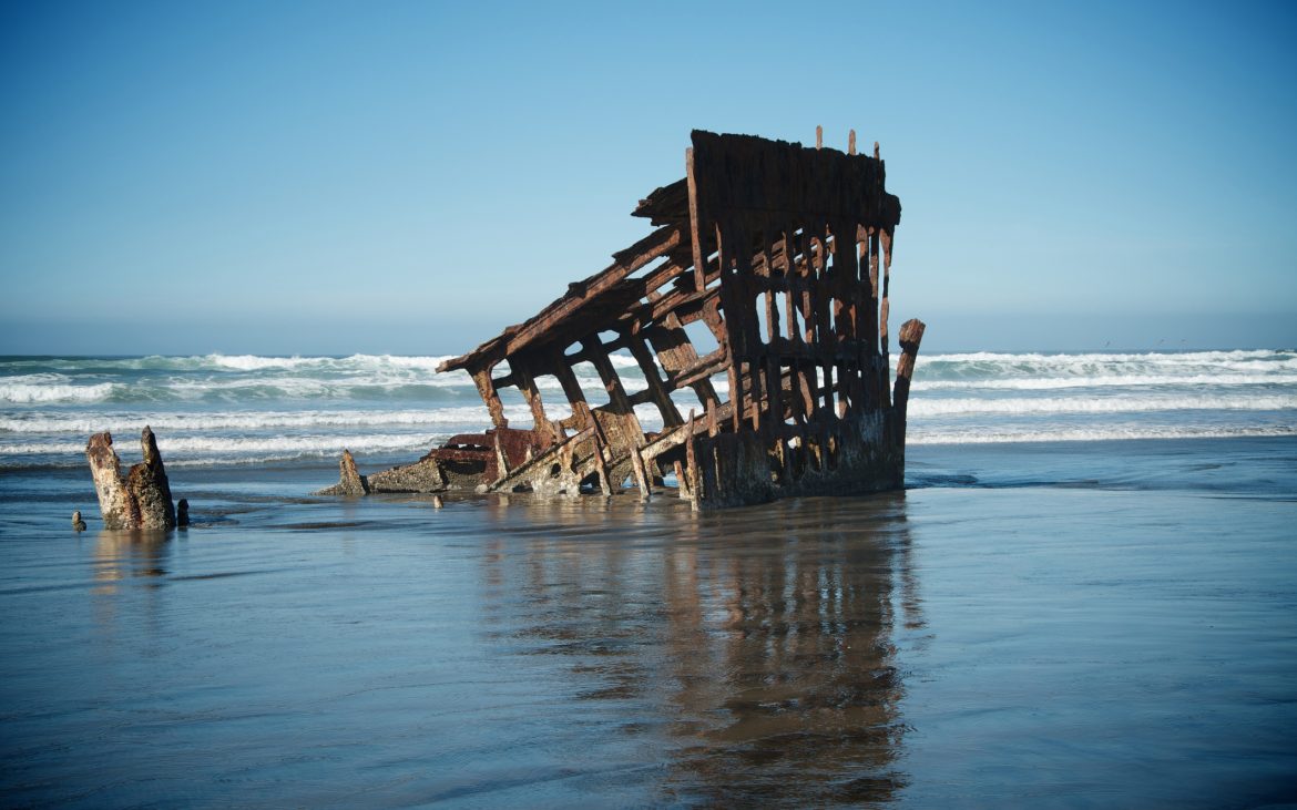 Shipwreck in ocean waves of Oregon