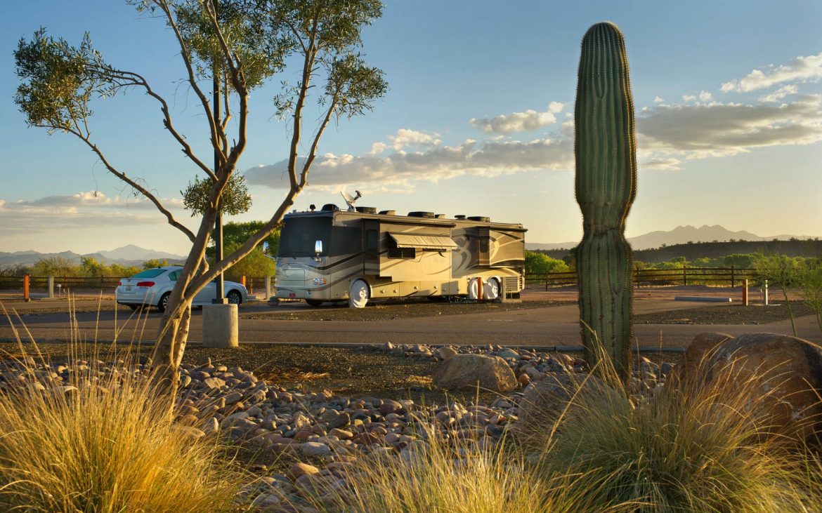 large RV parked along desert landscape