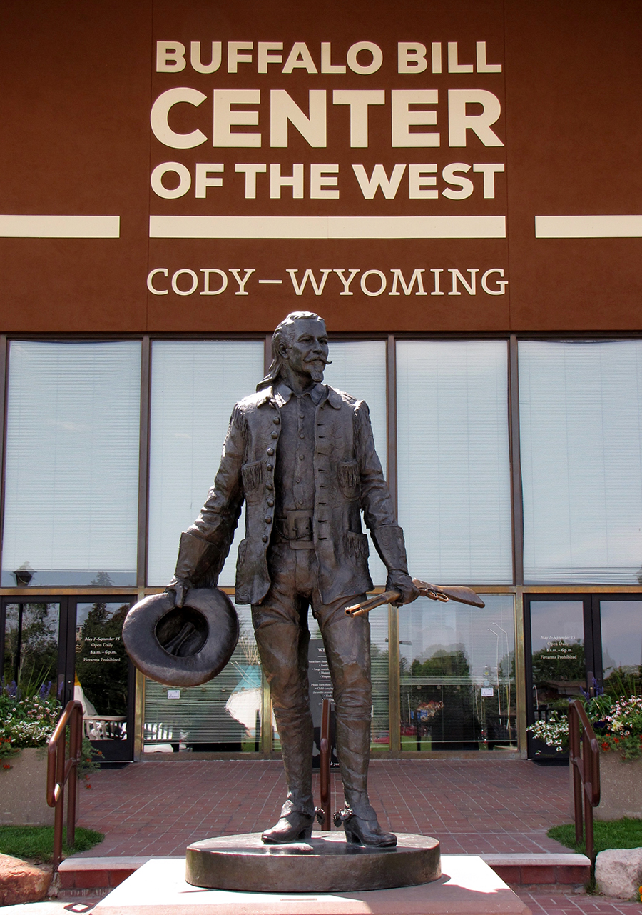 A statue of Buffalo Bill holding a rifle in Cody, Wyoming.