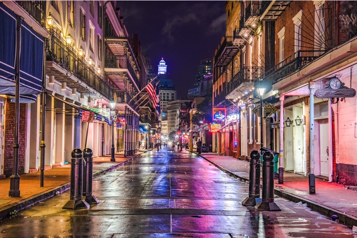 Evening lights reflecting off wet street in New Orleans