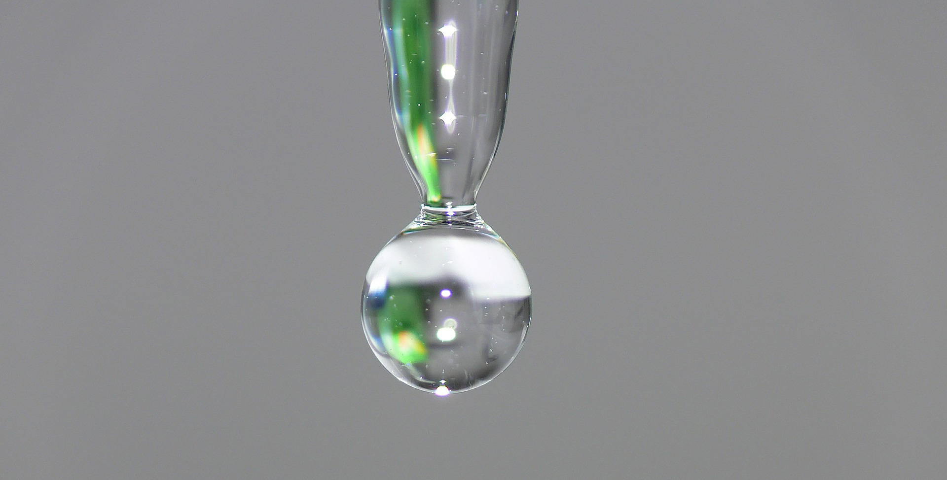 A closeup of water dripping through space.