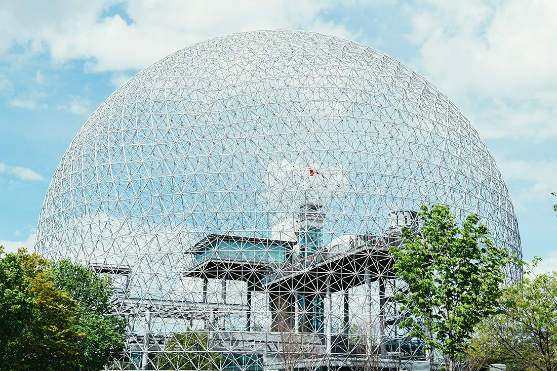 A bubble-like geodesic dome covers Montreal's Biosphere on a sunny day.