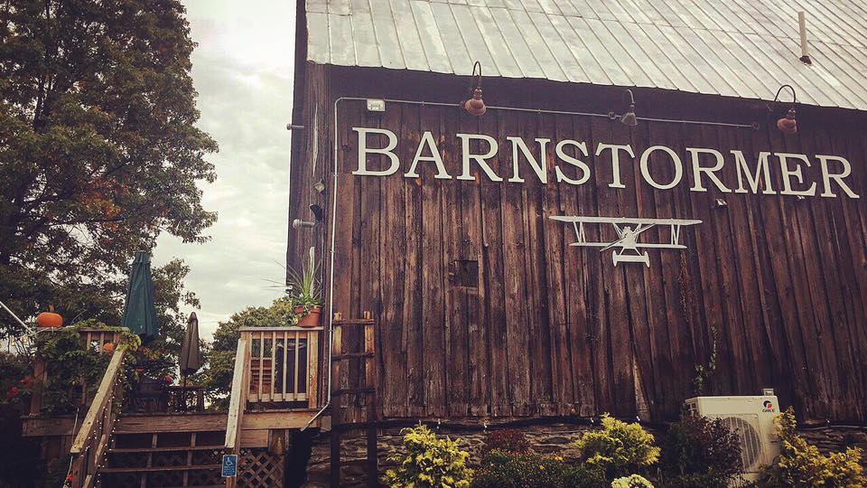 Nice barn and patio among vineyard on cloudy day
