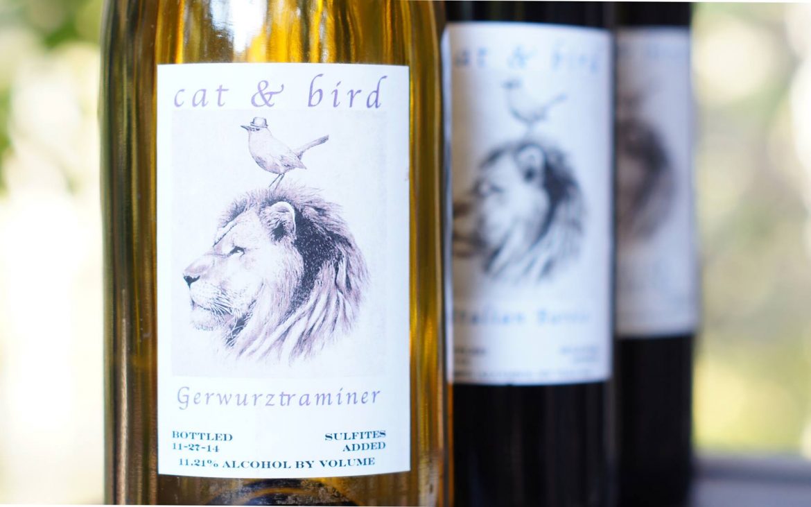 Three wine bottles with lion and bird on label