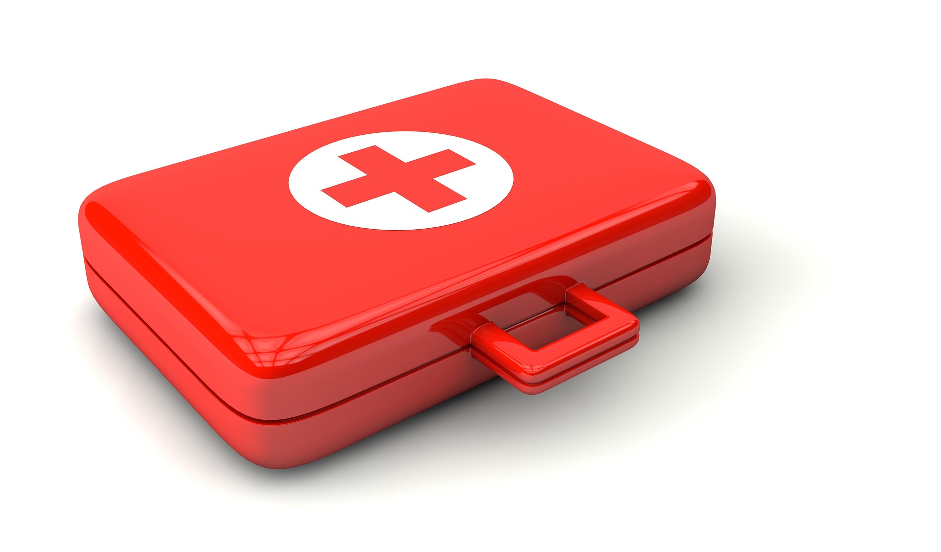 A gleaming red first aid kit with a handle for easy carrying.