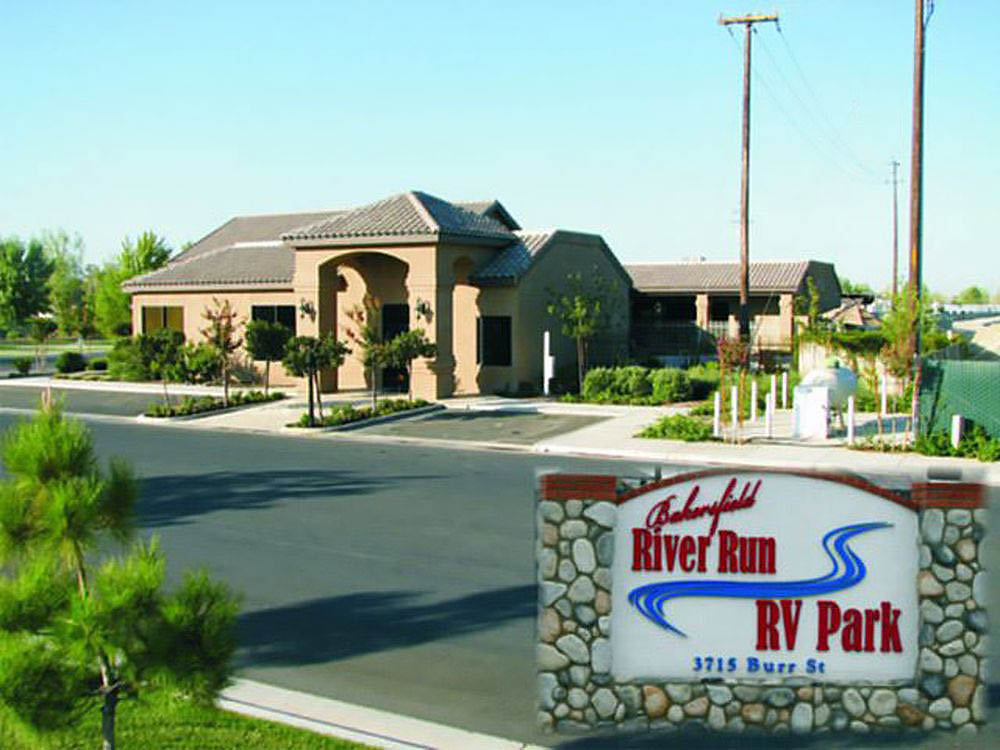 Sign for Bakersfield River Run RV Park in front of park office.