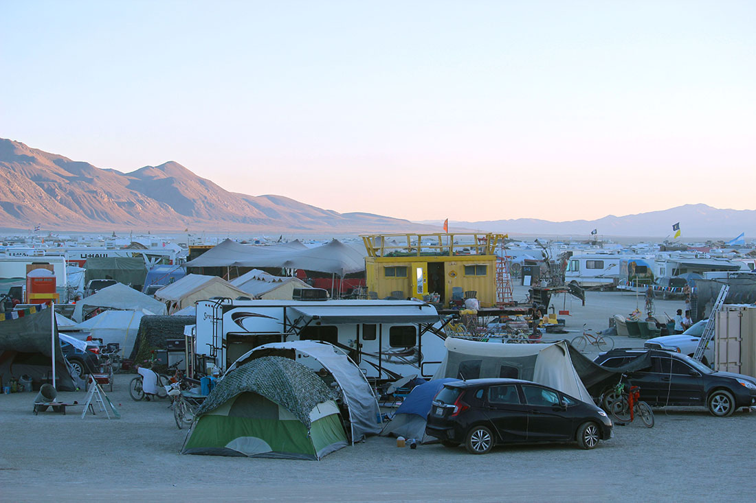 A sea of colorfully adorned RVs stretch into the horizon.