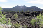 Rugged Lava Rock with the Volcano Crater in the Distance