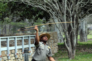 Antoine launches a dart from his atlatl