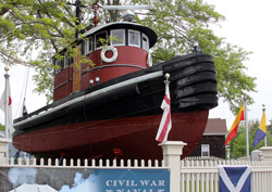 A tugboat welcomes tourists to Mystic Seaport, Connecticutt