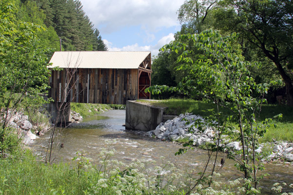 Covered bridges of all sizes and vintages cross rivers in Vermont and into New Hampshire.  IWhy?  Most likely so that horses crossing the bridges wouldn't be frightened by rushing water.  Or to prolong the life of the bridge.  Or to make crossing easier in the winter.