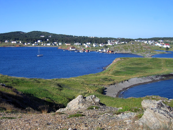 A typical Newfoundland village hugging the bright blue waters