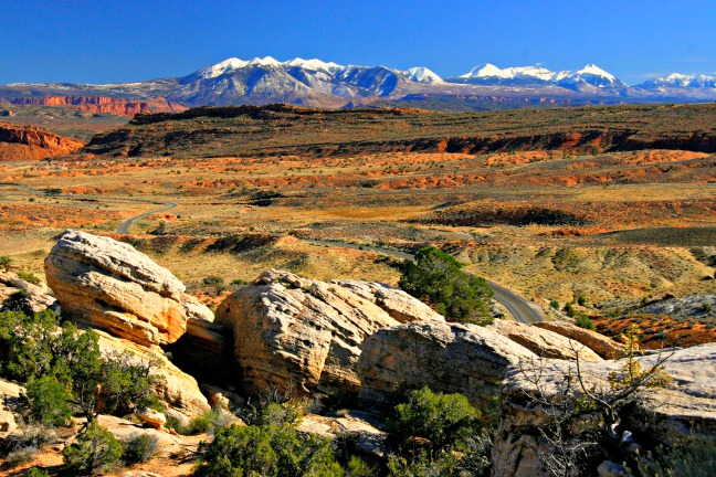 By standing relatively close to the large rocks in the foreground I was able to accentuate them and lead the viewer’s eye into the middleground and mountains in the background. Also notice how the road in the middleground leads the viewer’s eyes through the image. © Rex Vogel, all rights reserve