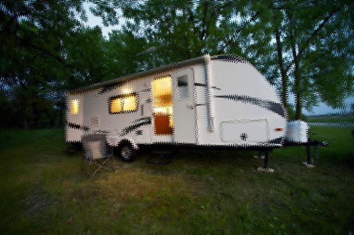 Trailer with lights on inside parked on grass at dusk