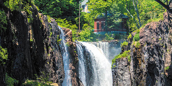 A waterfall plummets over a cliff.