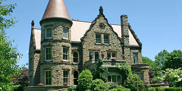 A palace-like home with rugged brick exterior.