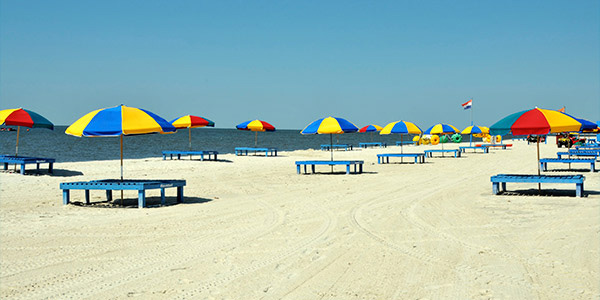 Whitesand beach with colorful umbrellas