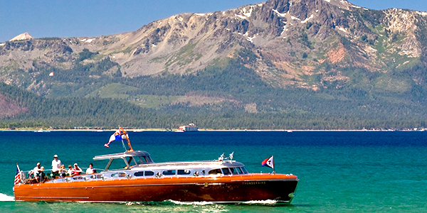 The Thunderbird Yacht, once owned by the eccentri George Whittell cruises past Edgewood Tahoe during the American Century Celebrity Golf Championship at Edgewood Tahoe
