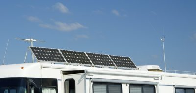 Camping with solar panels for converting energy from the sun to electricity.