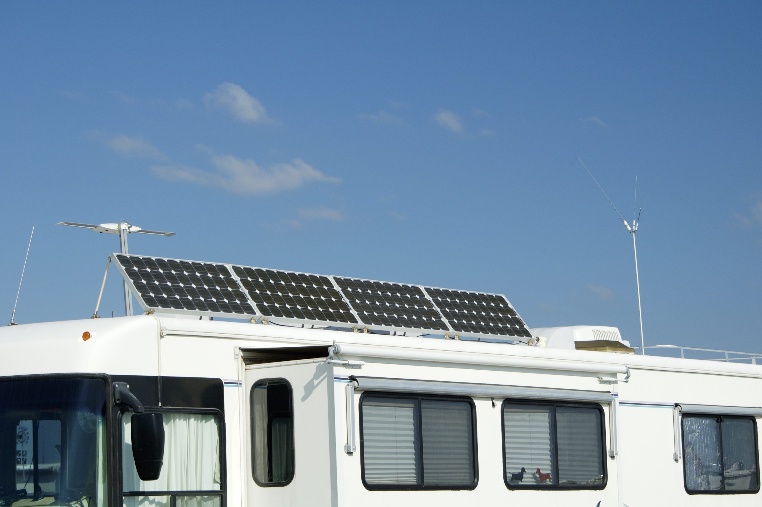 Camping with solar panels for converting energy from the sun to electricity.