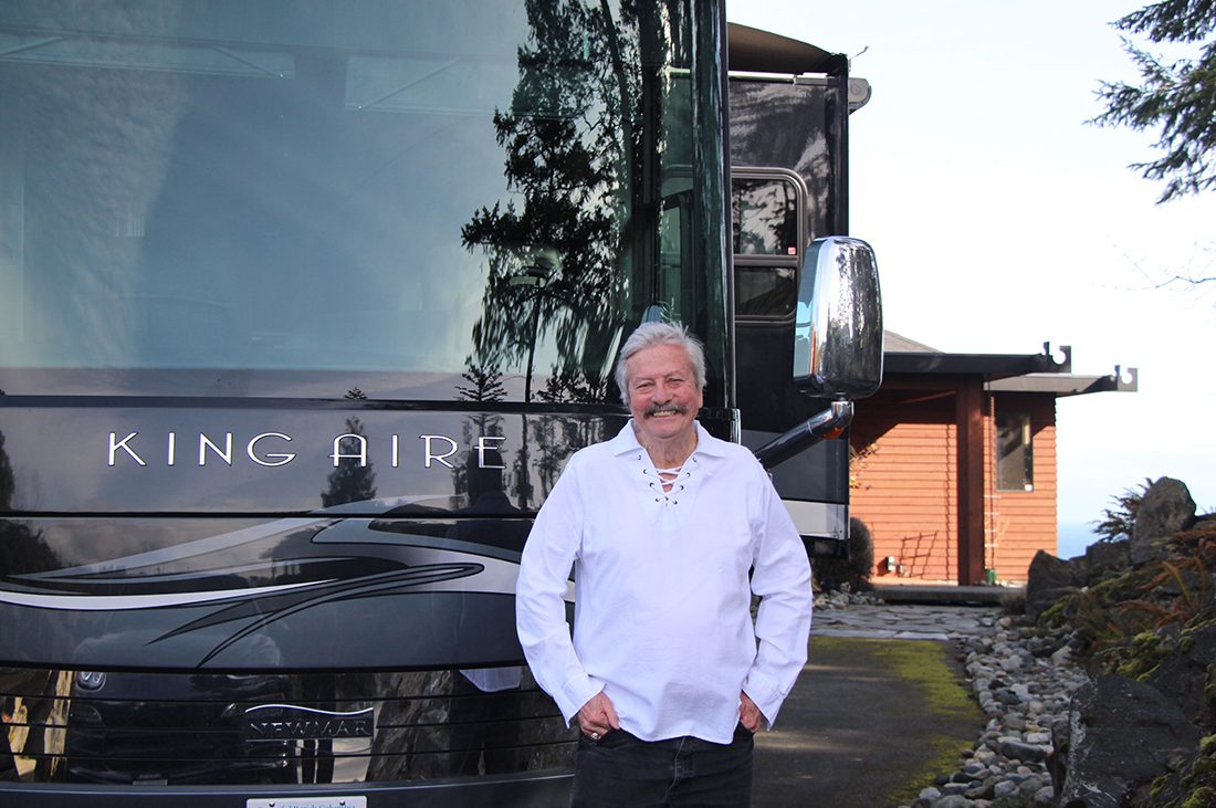 Man Standing in front of King Aire Motorhome