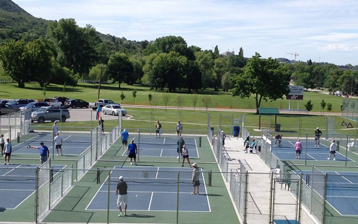 RV travelers play pickleball 