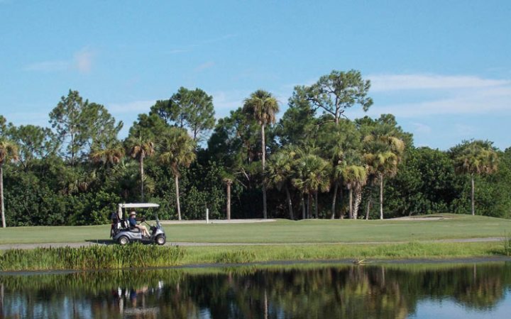 The Great Outdoors RV Resort - golf car by lake
