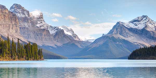 Lake with rugged mountains in background.