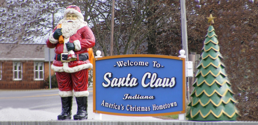 Santa Claus statue next to "Santa Claus Indiana America's Christmas Hometown" sign