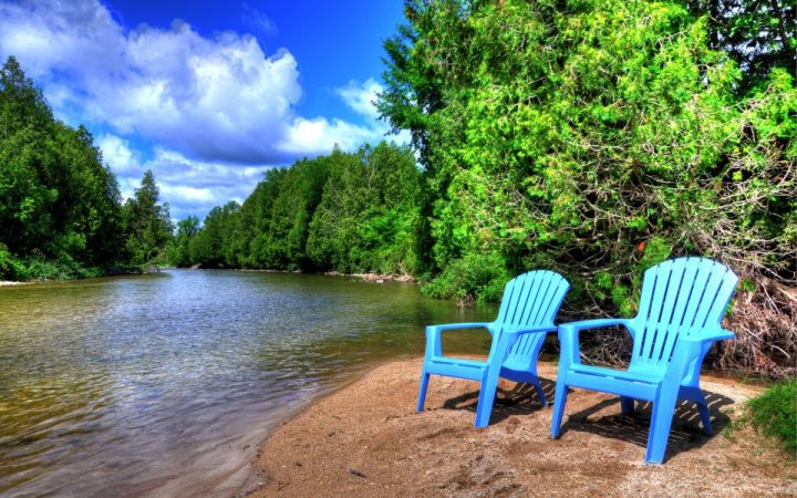 Saugeen Springs RV Park - chairs by river
